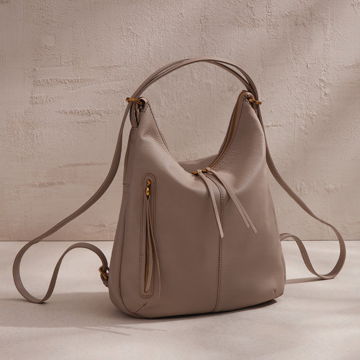Merrin Convertible Backpack in Pebbled Leather – Taupe - HOBO